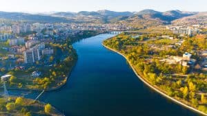 Aerial view of Kardzhali, Bulgaria – the city, Arda River, and the surrounding Eastern Rhodopes mountains at sunset