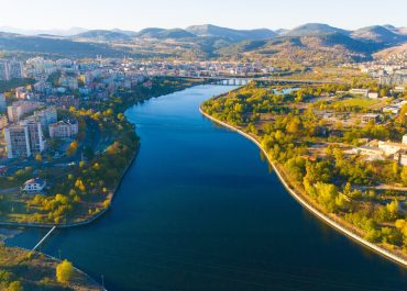Aerial view of Kardzhali, Bulgaria – the city, Arda River, and the surrounding Eastern Rhodopes mountains at sunset